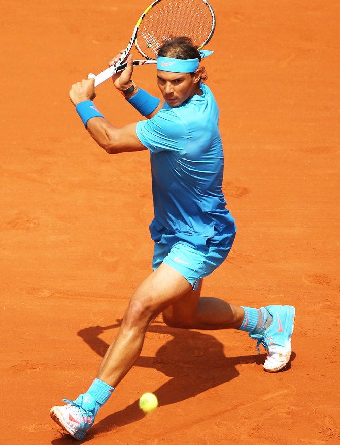 Spain's Rafael Nadal plays a backhand