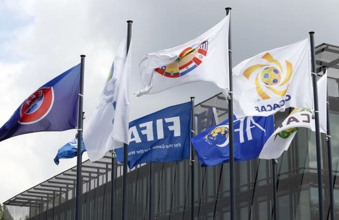 Flags are pictured in front of the headquarters of soccer's international governing body FIFA in Zurich
