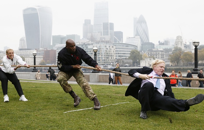 London Mayor Boris Johnson takes part in a tug of war