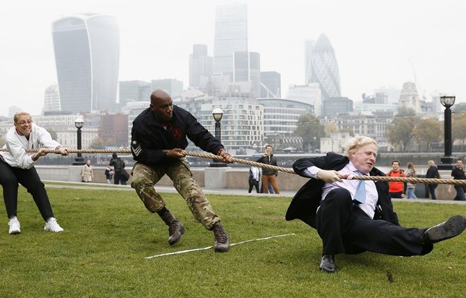 London Mayor Boris Johnson takes part in a tug of war with members of the armed services to launch the London Poppy Day on October 27. London Poppy Day is a street collection event to raise money for serving and retired members of the armed services and their families