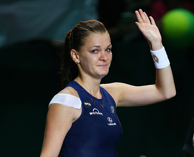 Agnieszka Radwanska of Poland waves to the crowd after defeating Petra Kvitova of Czech Republic in the final in Singapore 