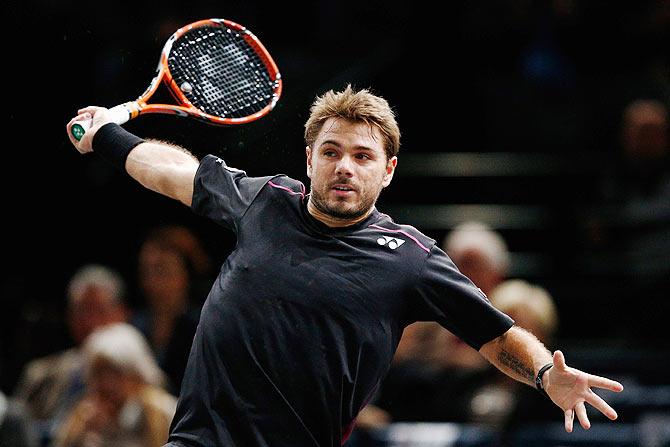 Switzerland's Stanislas Wawrinka in action against Australia's Bernard Tomic