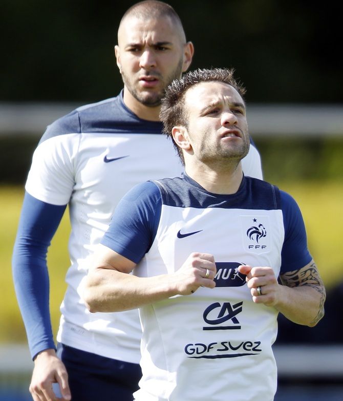 France’s national soccer team players Mathieu Valbuena (front) and Karim Benzema