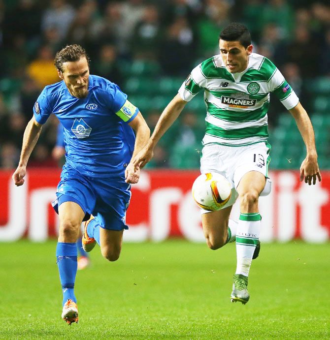 Molde's ODaniel Berg Hestad (left) and Celtic's Tomas Rogic vie for possession during their UEFA Europa League match at Celtic Park in Glasgow
