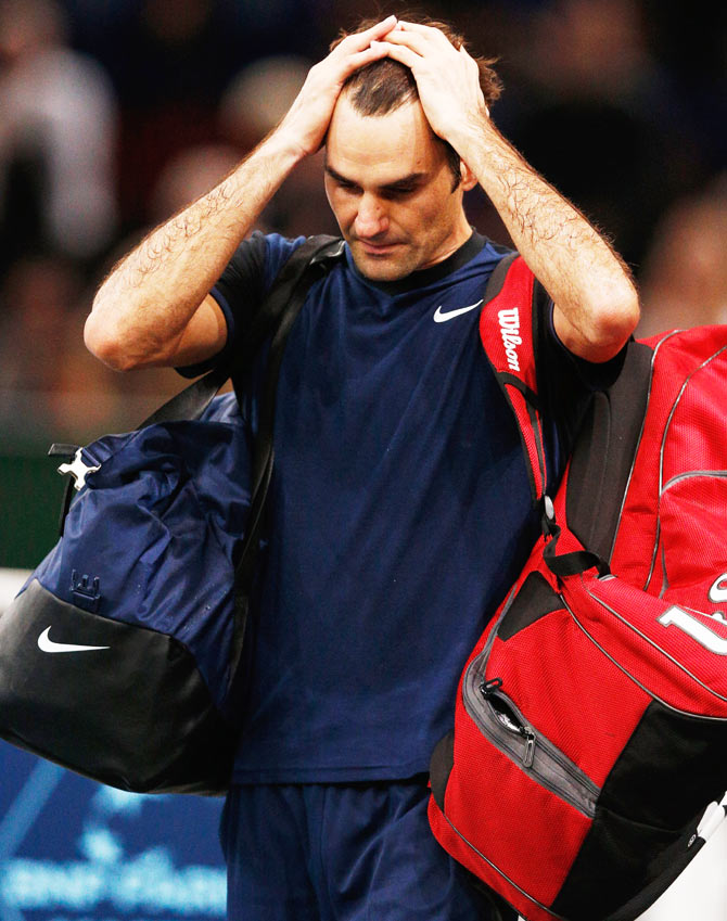 Switzerland'S Roger Federer looks dejected after his defeat against USA's John Isner during the BNP Paribas Masters held at AccorHotels Arena Paris on Thursday