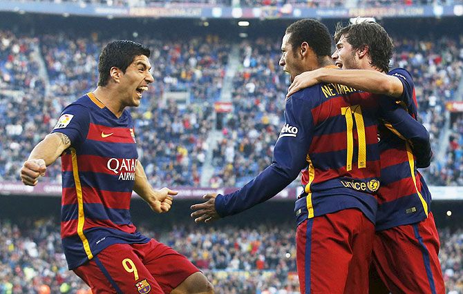 Barcelona's Luis Suarez (left), Neymar (centre) and Sergi Roberto celebrate a goal against Villarreal during their La Liga match at Camp Nou stadium in Barcelona on Sunday