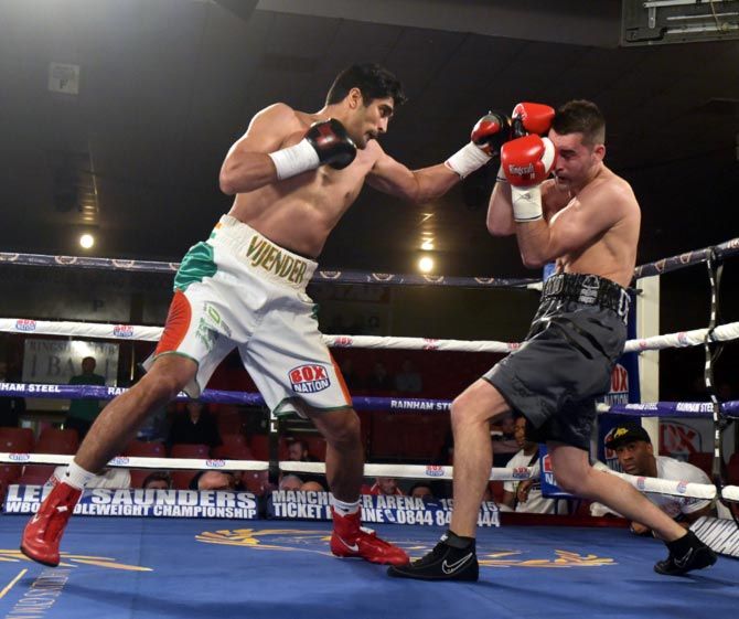Vijender Singh (left) in action against Dean Gillen during their middleweight bout