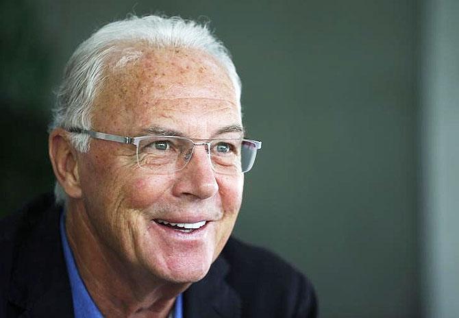 Bayern Munich's former President Franz Beckenbauer speaks to the media