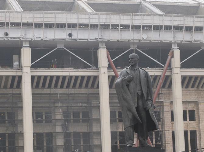 A monument of the Soviet state founder Vladimir Lenin is seen in front of the Luzhniki stadium, which hosted the IAAF World Athletics Championships 2013 and is now under reconstruction, in Moscow on Tuesday