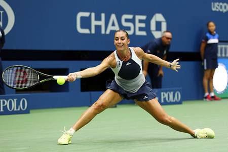 Italy’s Flavia Pennetta executes a forehand return