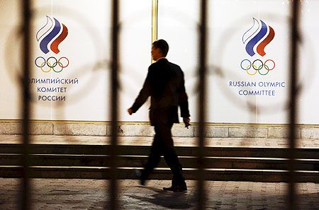 A man walks in front of the Russian Olympic Committee headquarters building, which also houses the management of Russian Athletics Federation in Moscow