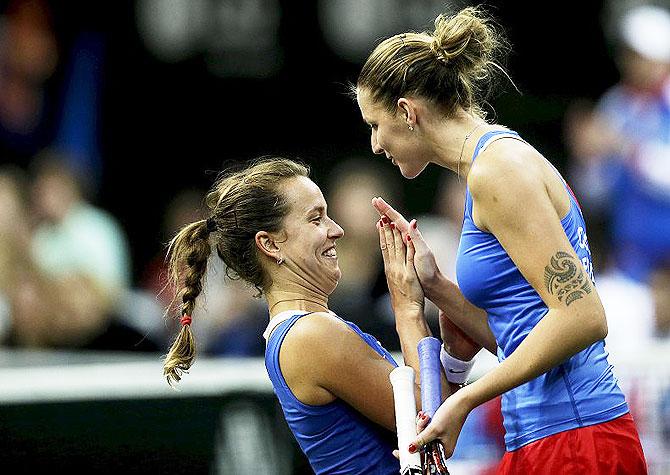 Czech Republic's Karolina Pliskova (left) and Barbora Strycova react during their final match of the Fed Cup tennis tournament against Russia's Anastasia Pavlyuchenkova and Elena Vesnina