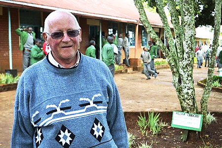 Brother Colm O'Connell poses for a photo at St Patrick's High School, where trees have been planted to honour former pupils who have gone on to become world champions, in Kenya's Iten village