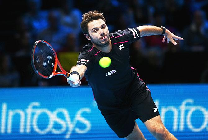 Switzerland's Stanislas Wawrinka stretches to play a forehand