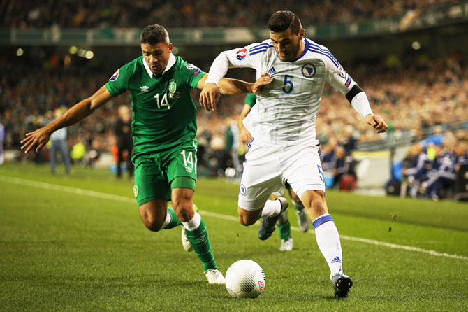 Jon Walters of the Republic of Ireland and Sead Kolasinac of Bosnia and Herzegovina compete for the ball during their UEFA EURO 2016 Qualifier play-off, second leg match at the Aviva Stadium in Dublin on Monday