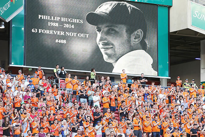 The crowd clapped at the 63rd minute of an A-League match between Brisbane Roar and Perth Glory at Suncorp Stadium in Brisbane as a tribute to Australian Cricketer Phillip Hughes