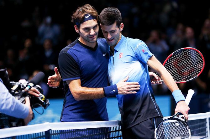 Roger Federer (left) embraces Novak Djokovic after his straight sets victory