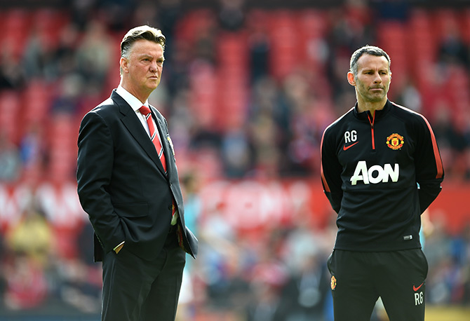  Manchester United Manager Louis van Gaal (left) looks on with Assistant Ryan Giggs 