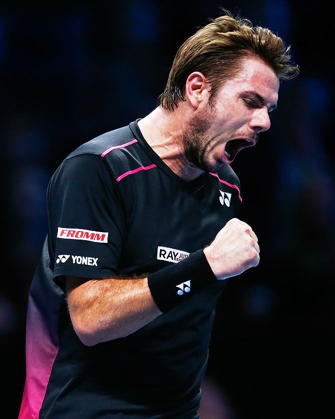 Switzerland's Stanislas Wawrinka celebrates a point in his men's singles match against Spain's David Ferrer on Day 4 of the ATP World Tour Finals at the O2 Arena in London on Wednesday