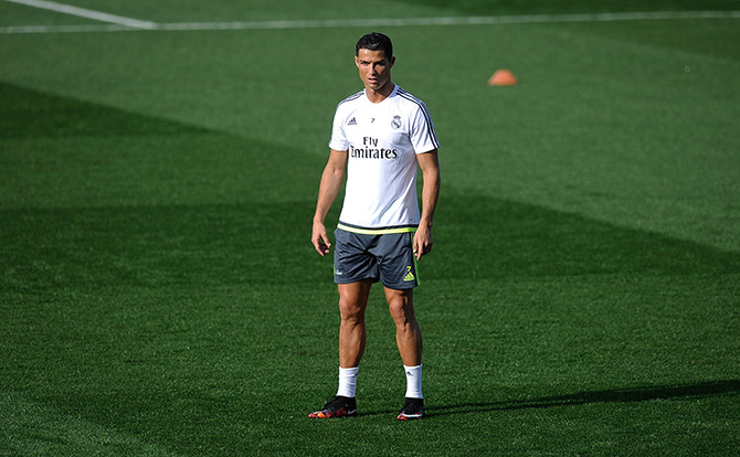 Cristiano Ronaldo of Real Madrid looks on during the team training session 