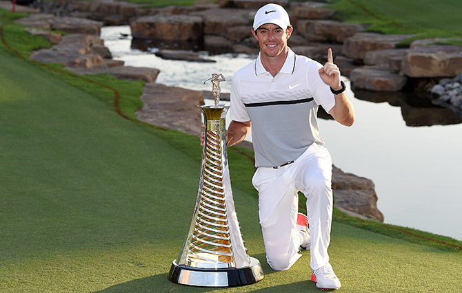 Rory McIlroy of Northern Ireland with the Race to Dubai Trophy 