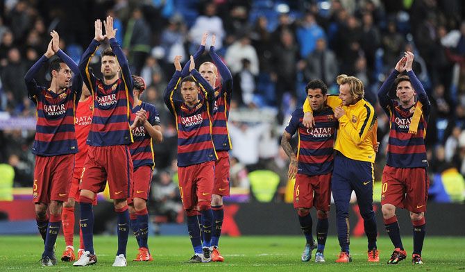 FC Barcelona players celebrate after beating Real Madrid 4-0 on Sunday