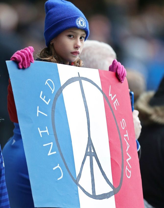 A Chelsea fan with a France banner before the Premier League match between Chelsea and Norwich City on November 21