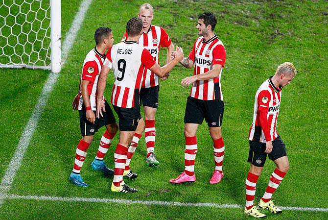Captain Luuk de Jong of PSV celebrates scoring 