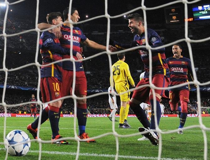 Champions League PIX: Barca drub Roma; Arsenal's hopes alive - Rediff ...