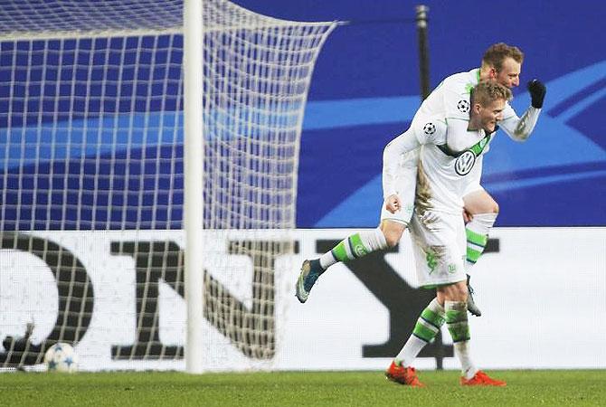 VfL Wolfsburg's Andre Schuerrle celebrates with his teammate Maximilian Arnold after scoring a goal against CSKA Moscow during their Champions League Group B match at Arena Khimki, in Khimki, Russia, on Wednesday