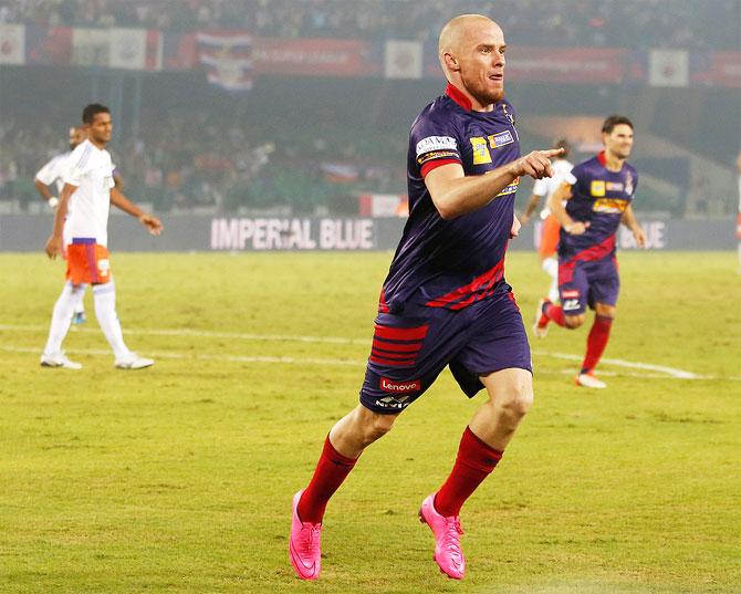 Iain Hume of Atletico de Kolkata celebrates his 2nd goal against FC Pune City on Friday