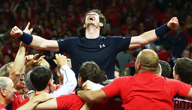 Andy Murray of Great Britain celebrates with his team after winning his singles match against David Goffin of Belgium and clinching the Davis Cup title on Day 3 of the Davis Cup Final 2015 at Flanders Expo in Ghent, Belgium, on Sunday