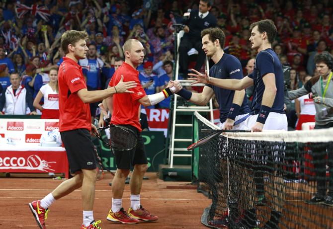 Great Britain's Andy Murray and Jamie Murray shake hands with Belgium's Steve Darcis and David Goffin after winning their match 