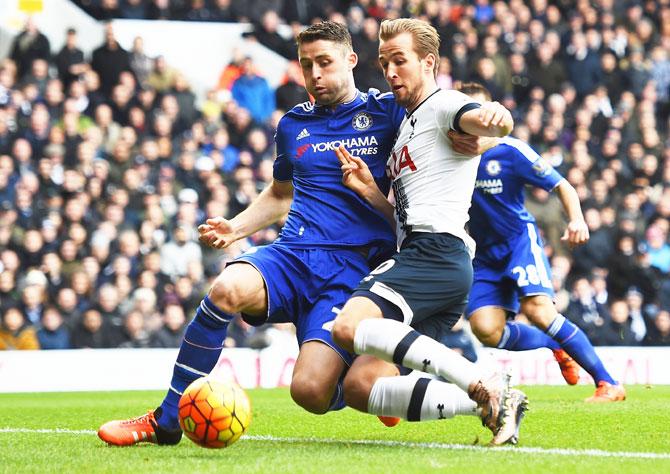 Tottenham Hotspur's Harry Kane is challenged by Chelsea's Gary Cahill during their Barclays English Premier League match at White Hart Lane in London on Sunday