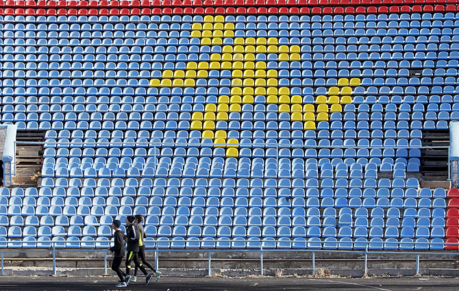 Sportsmen train at a local stadium in the southern city of Stavropol, Russia