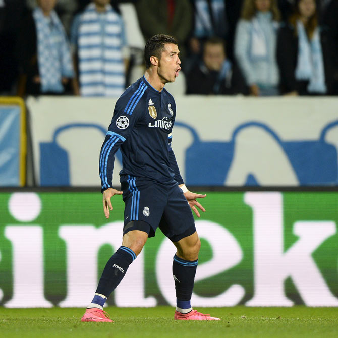 Real Madrid's Cristiano Ronaldo celebrates scoring the opening goal against Malmo FF during their Champions League Group A match at Malmo New Stadium in Malmo, Sweden on Wednesday