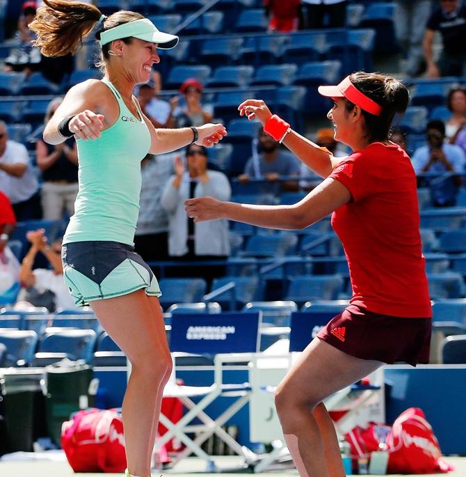 Martina Hingis of Switzerland (left) celebrates with Sania Mirza 