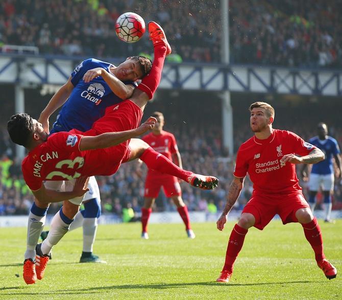 Emre Can of Liverpool and Ramiro Funes Mori of Everton