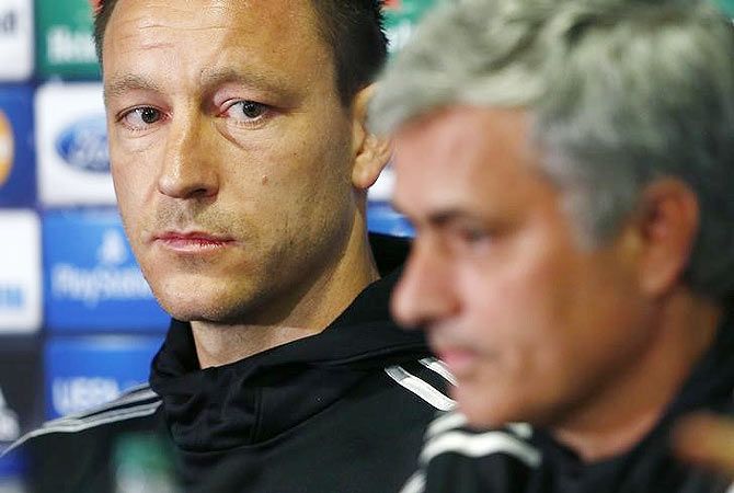 Chelsea's coach Jose Mourinho (right) and captain John Terry attend a media conference at Stamford Bridge in London