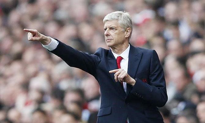 Arsenal manager Arsene Wenger directs his players during their English Premier League match against Manchester United on Sunday