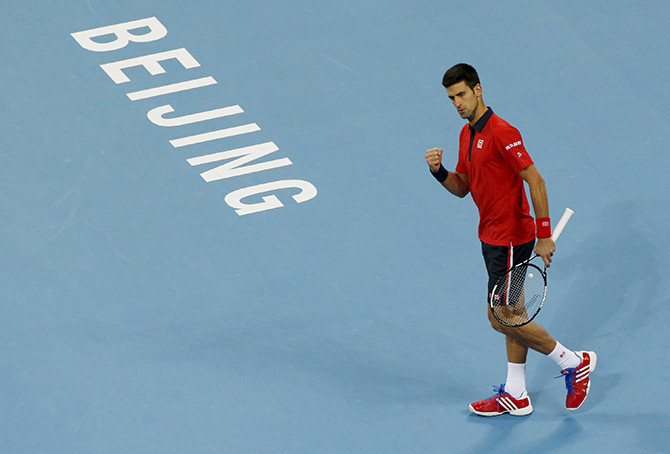 Novak Djokovic of Serbia reacts after wining a point 