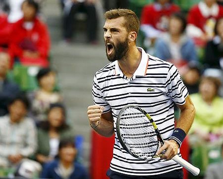 France's Benoit Paire reacts after winning a point against Japan's Kei Nishikori during their men's singles semi-final match at the Japan Open tennis championships in Tokyo on Saturday