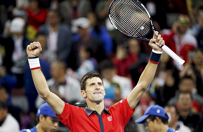 Serbia's Novak Djokovic celebrates after winning the China Open men's singles final against Spain's Rafael Nadal in Beijing on Sunday