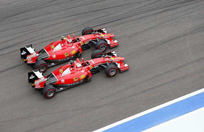 Ferrari's Kimi Raikkonen and Sebastian Vettel go head to head