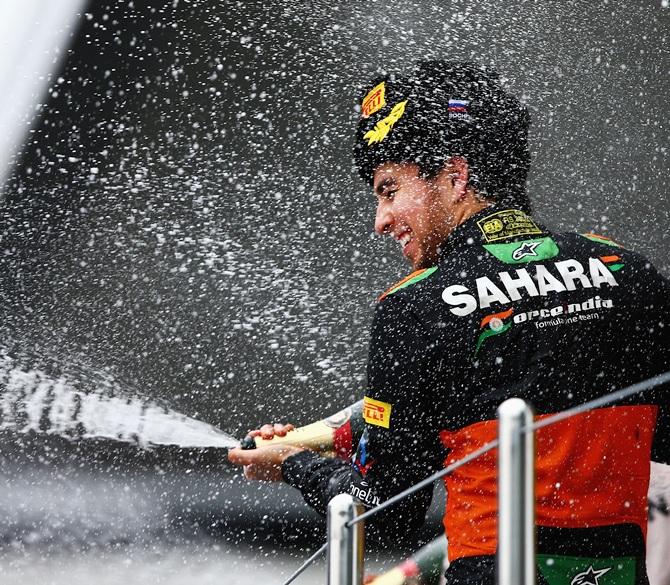 Force India’s Sergio Perez celebrates on the podium after finishing third in the Formula One Grand Prix of Russia at Sochi on October 11