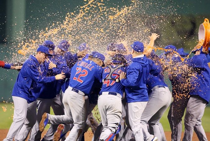 The Chicago Cubs celebrate after defeating the Pittsburgh Pirates in the National League Wild Card playoff baseball game at PNC Park on October 7