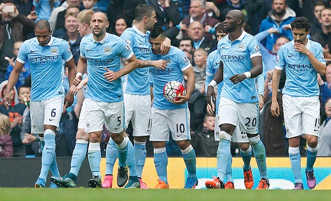 Manchester City players celebrate a goal 