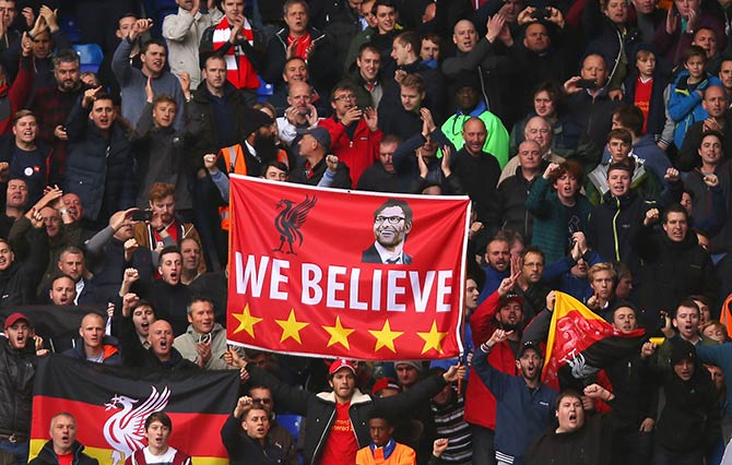 A banner to support new manager Jurgen Klopp is displayed among Liverpool supporters stand 