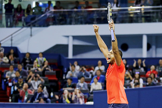 Jo-Wilfried Tsonga of France celebrates after beating Rafael Nadal of Spain in their men's singles semi-final match 