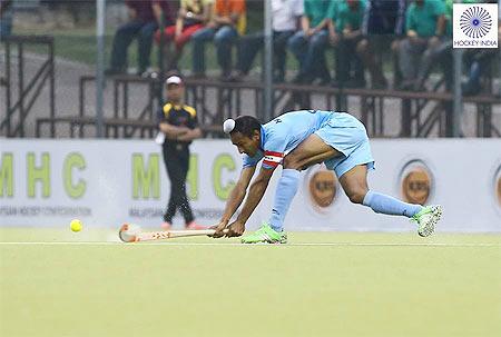 A junior India hockey player in action